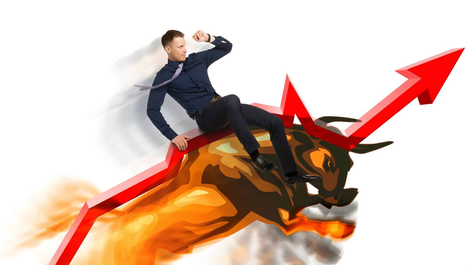 man riding bull on an upward trending arrow