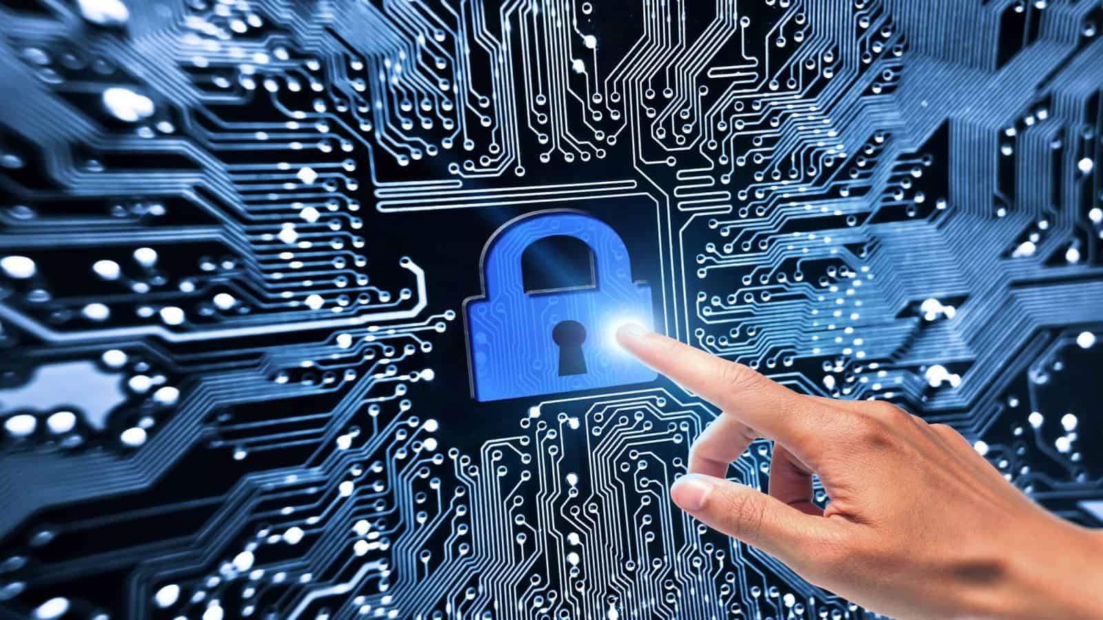 A hand pointing to security lock symbol on computer circuit board, indicating a share price movement for software security companies
