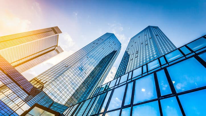 ASX real estate investment trust or REIT represented by high rise city buildings photographed from below