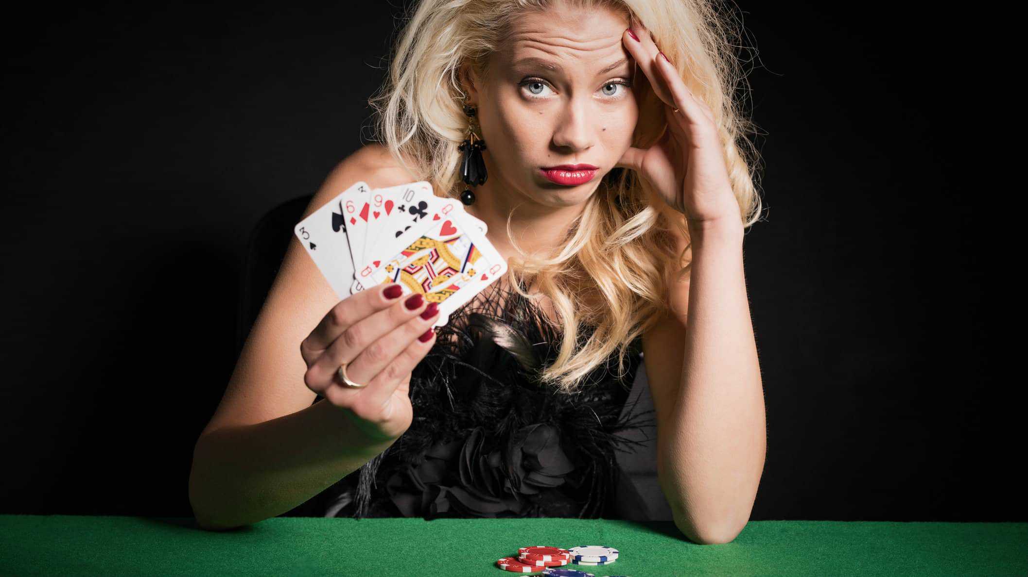Falling asx share price represented by woman with bad poker hand at casino