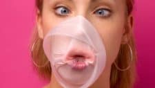 share price bubble burst represented by girl with popped bubblegum on her face
