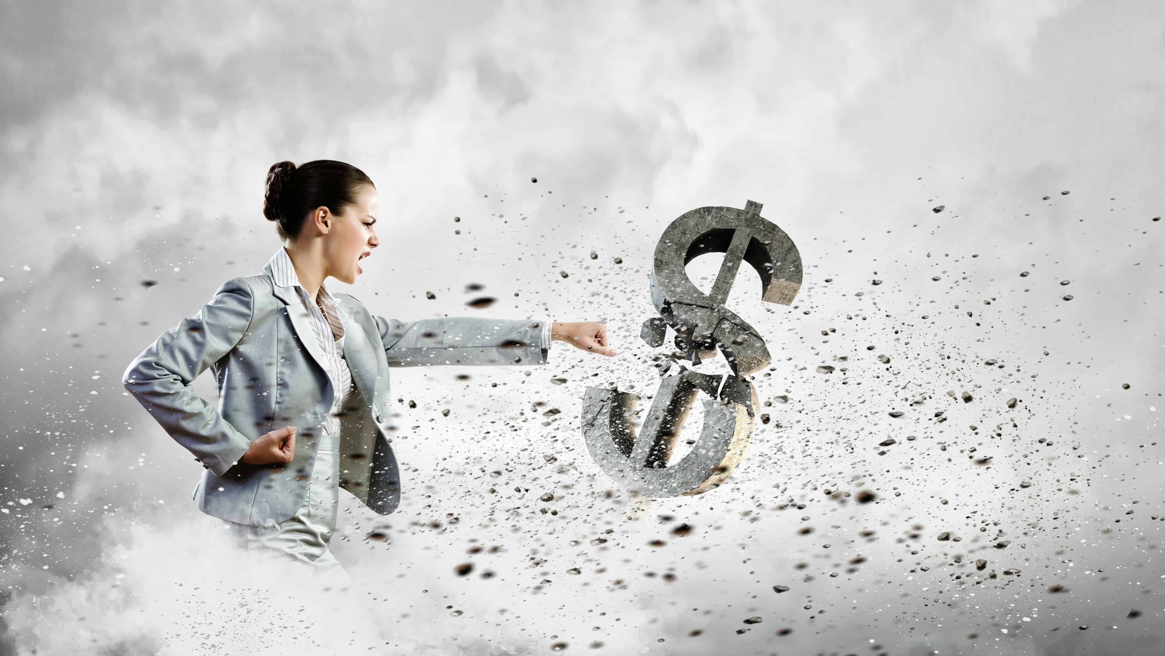A woman smashes a dollar sign with her fist.
