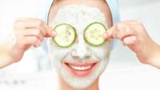 skin care asx share price represented by happy woman holding cucumbers over eyes