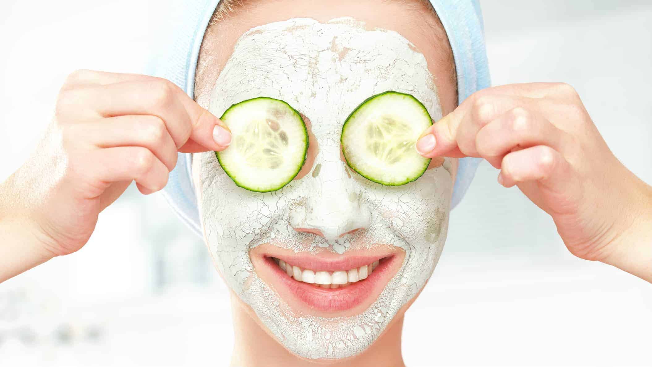 skin care asx share price represented by happy woman holding cucumbers over eyes