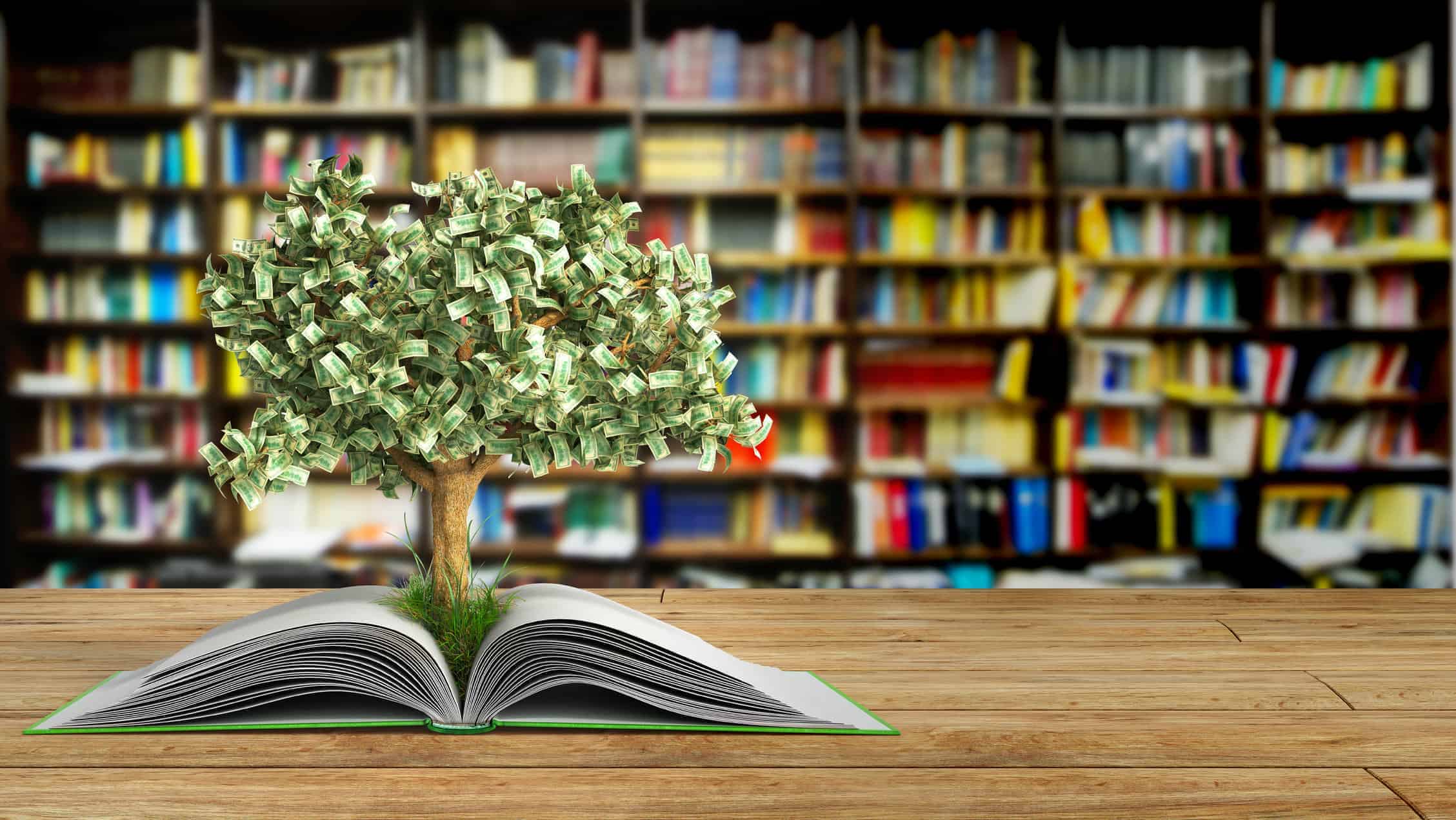 miniature tree growing out of a book in a library