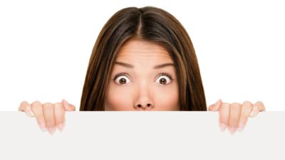 Woman peeking over ledge