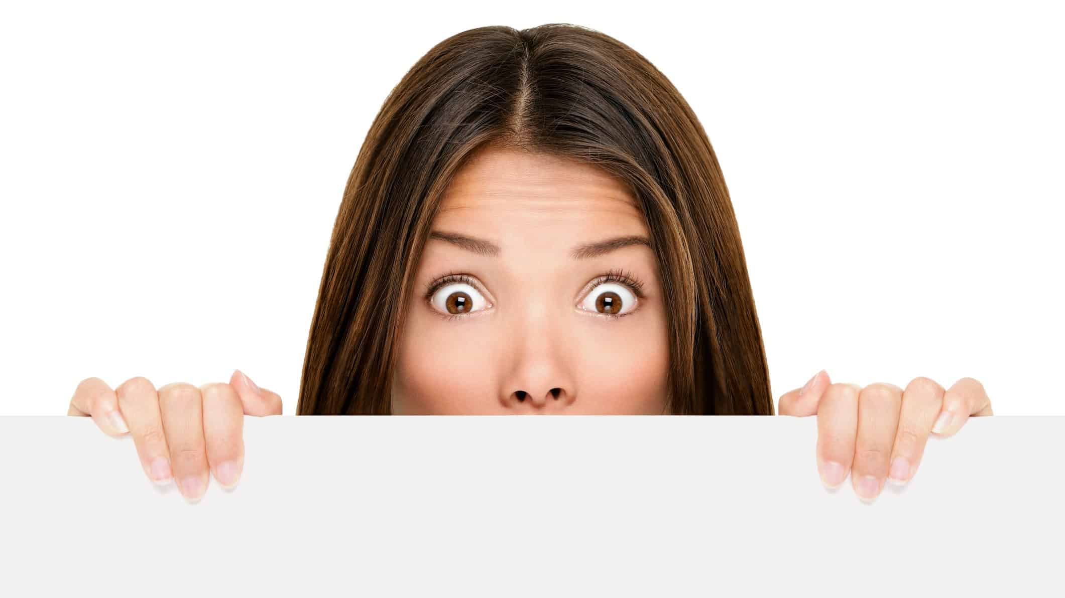 Woman peeking over ledge