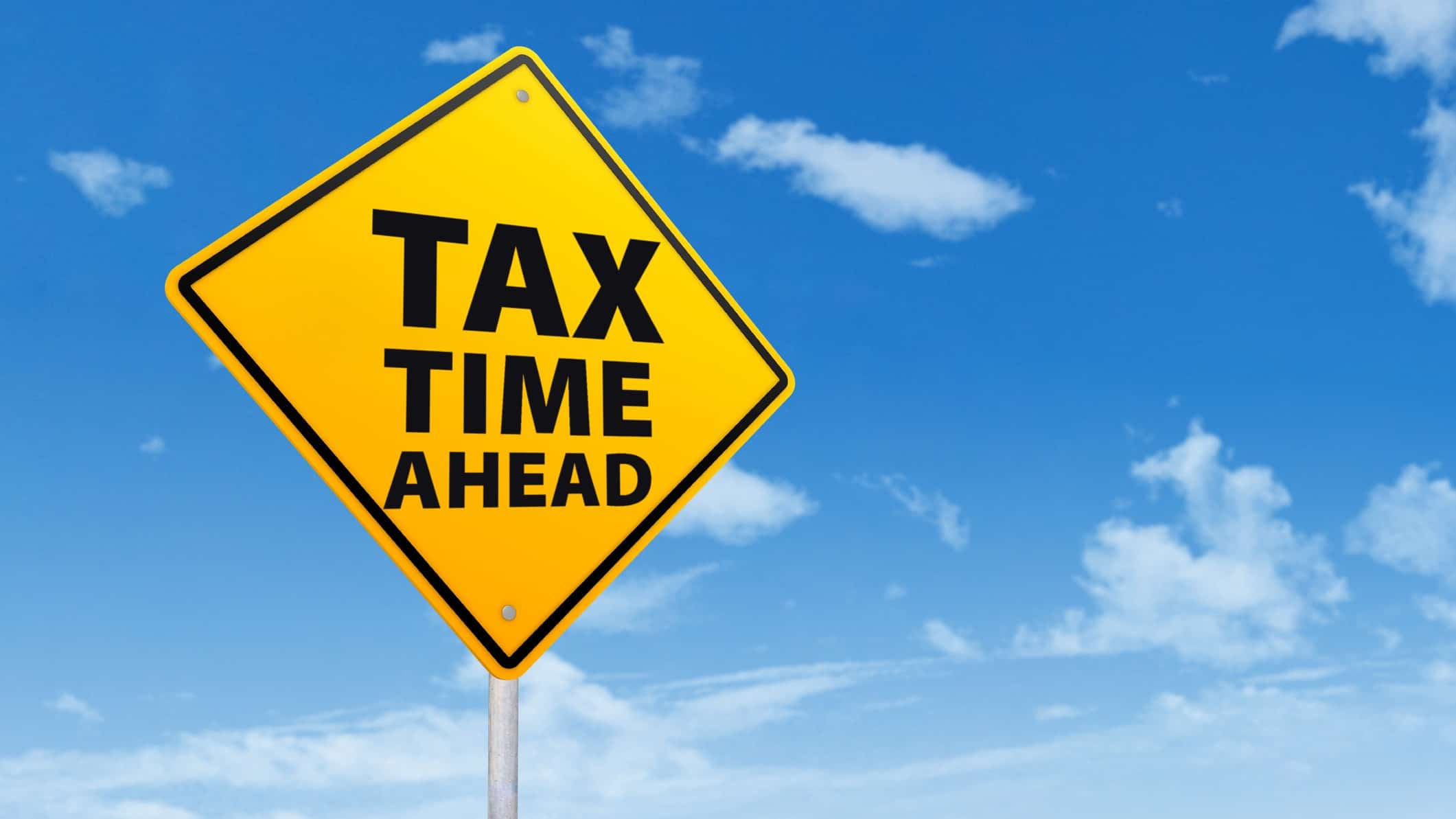 Road sign stating Tax Time Ahead,