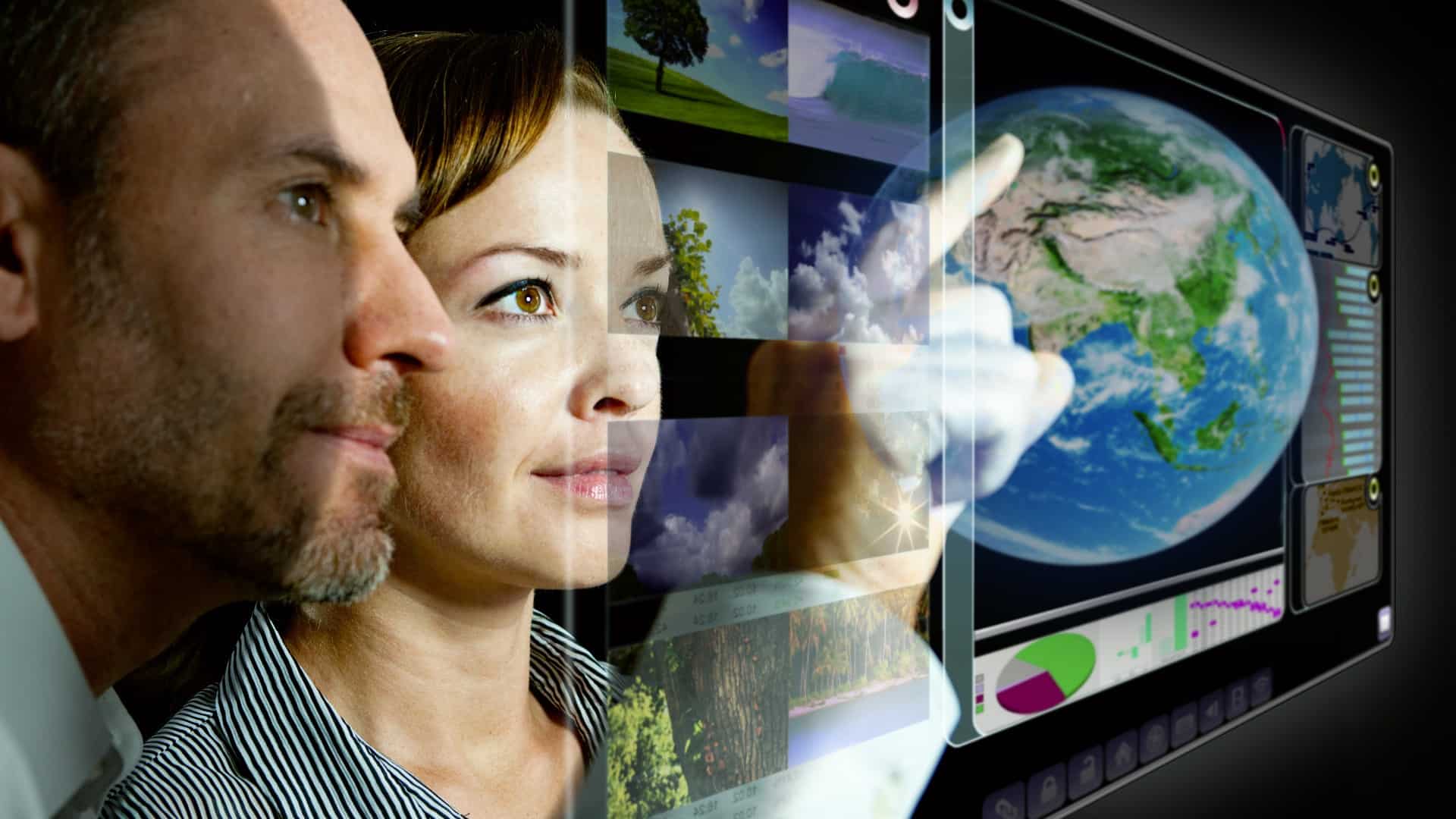 Two team members touching digital futuristic screen