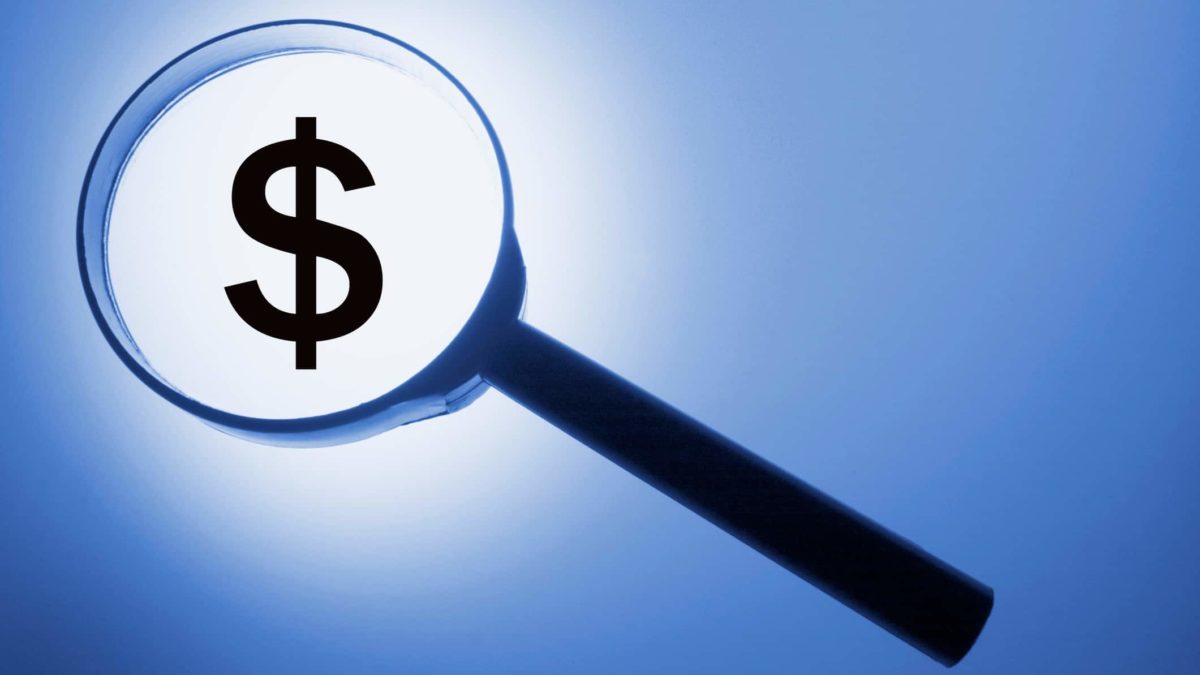 maginfying glass over dollar sign