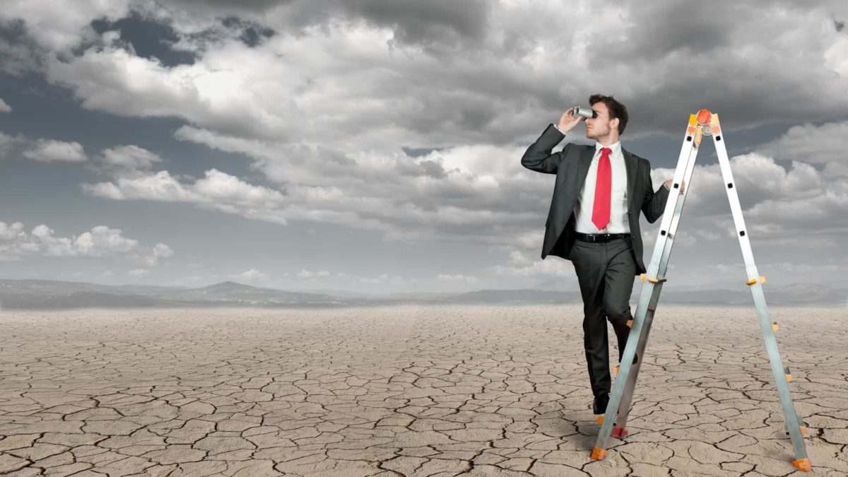 businessman searching for opportunity in drought conditions