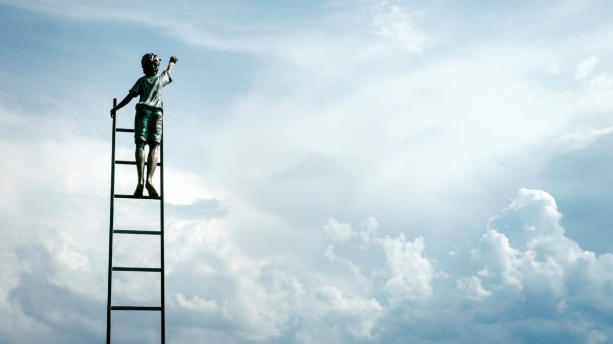 ASX shares new high represented by boy standing on ladder against the backdrop of a cloudy sky