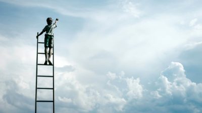 ASX shares new high represented by boy standing on ladder against the backdrop of a cloudy sky