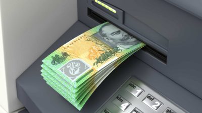 ASX dividend shares represented by ATM delivering wad of $100 notes
