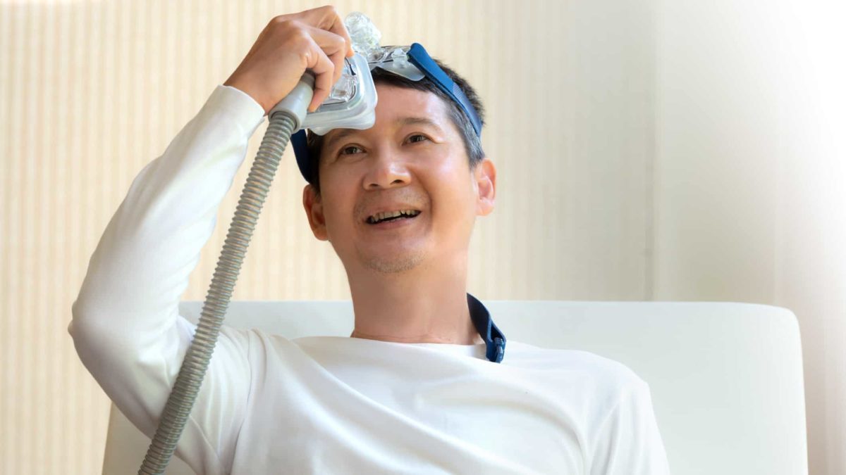 Happy man with CPAP machine