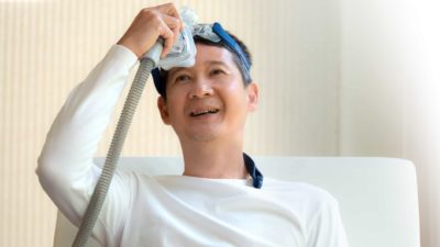 Happy man with CPAP machine