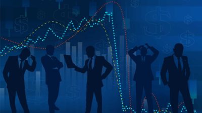 silhouettes of businessman against chart showing sharp falls