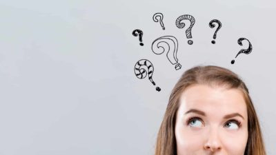 Questioning asx share price represented by women with virtual question marks above her head