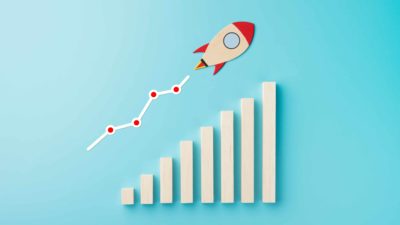 asx share price growth represented by rocket flying up increasing bar chart.