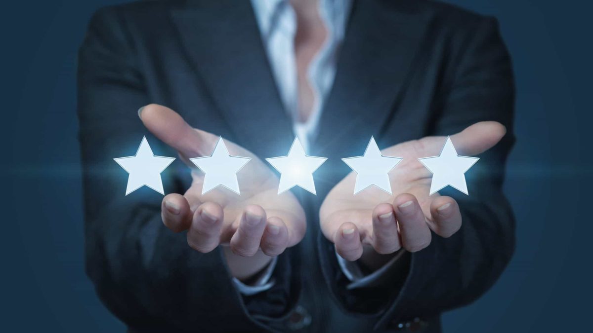 hands holding 5 stars