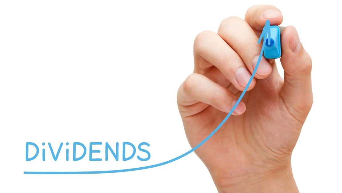 Hand drawing growing Dividends investment business graph with blue marker on transparent wipe board.