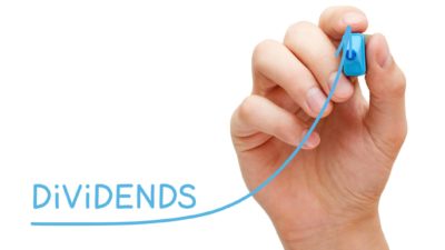 Hand drawing growing Dividends investment business graph with blue marker on transparent wipe board.