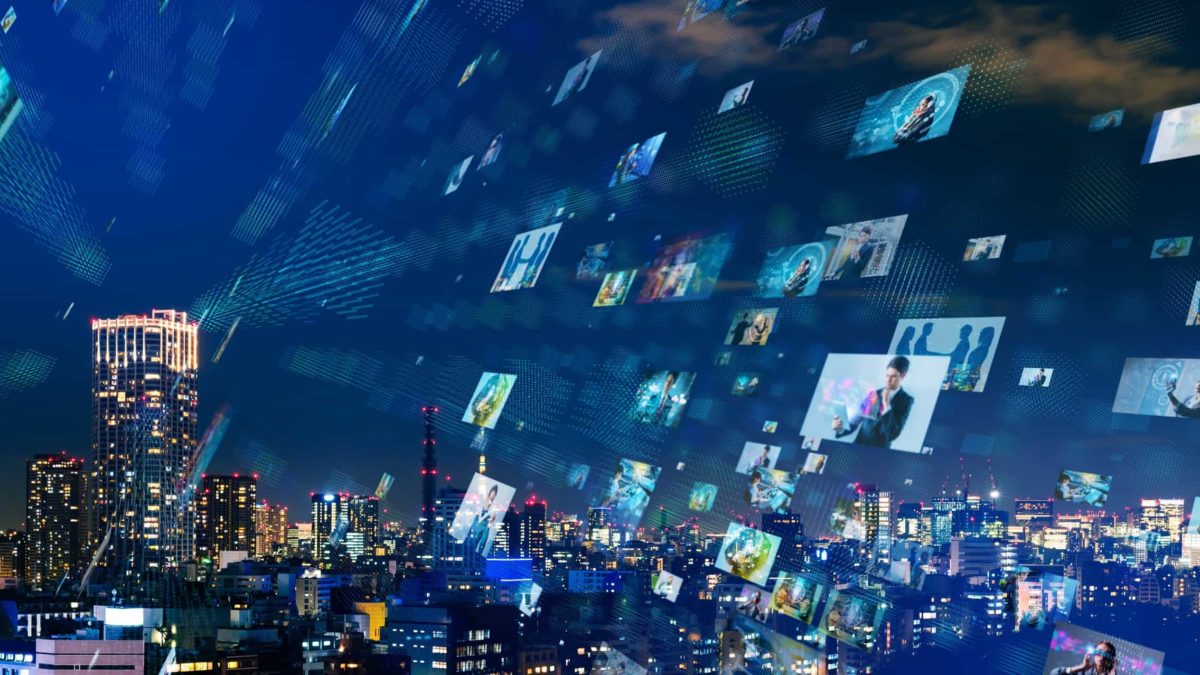 Cityscape at night superimposed with pictures from digital media streaming organisation, southern cross media share price