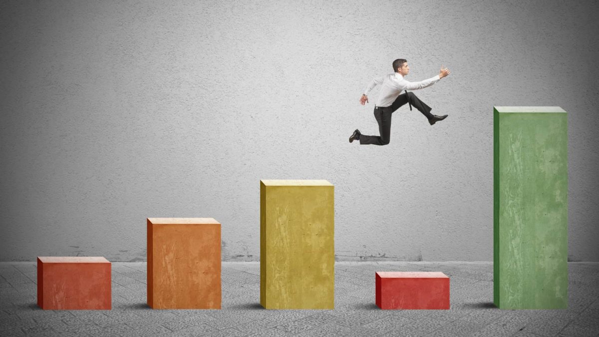 bar graph with man jumping over low number representing dip in asx shares