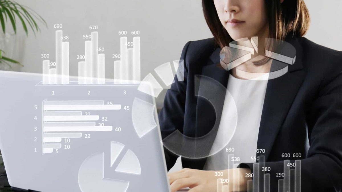 ASX share price on watch represented by woman investor looking at ASX financial results on laptop