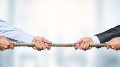 asx shares represented by business men engaged in tug of war