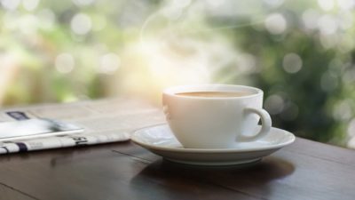 cup of coffee and newspaper signifying asx 200 weekly wrap