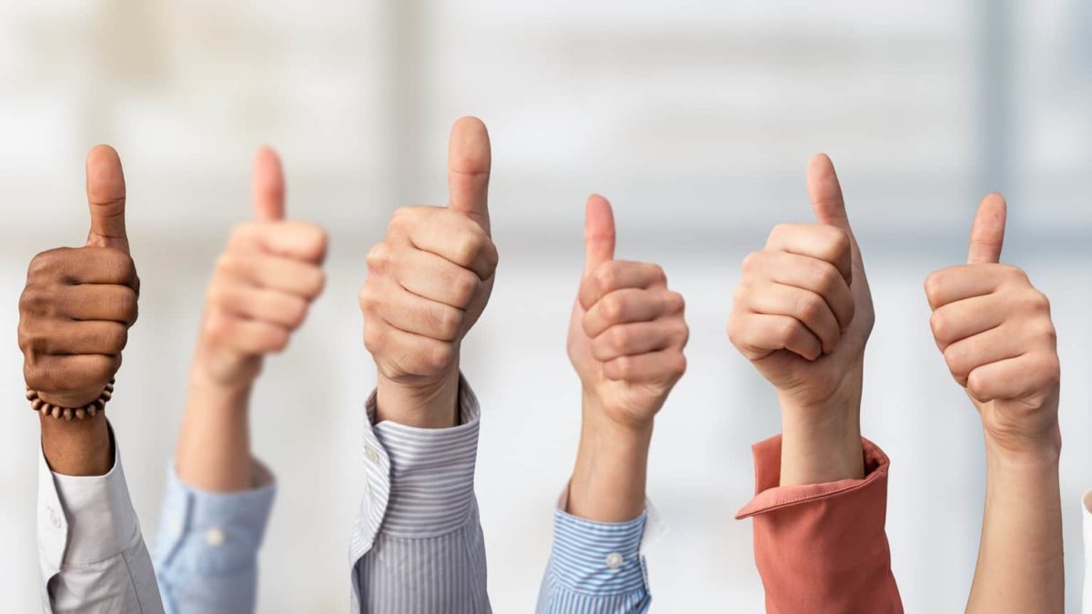 positive asx share price represented by lots of hands all making thumbs up gesture