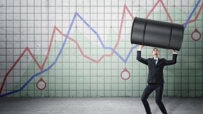 ASX oil shares recovery man holding up barrel of oil against rising chart representing rising oil search share price