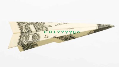 Paper plan made out of dollar note signifying qantas share price