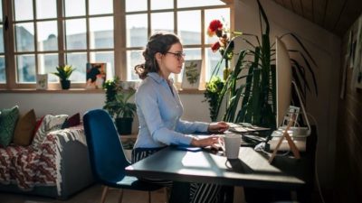 woman sitting and working on computer