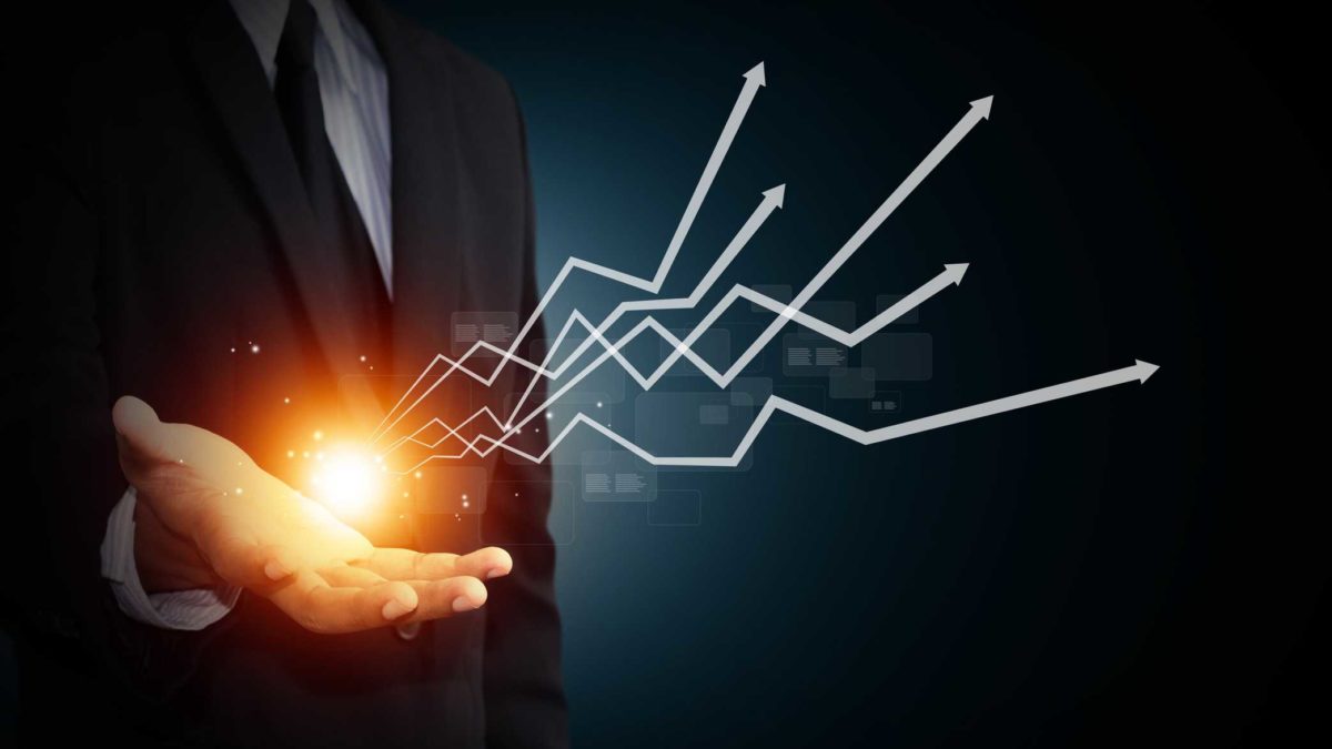 Investor with palm up and graphic illustration of asx small cap tech shares charts shooting from his hand