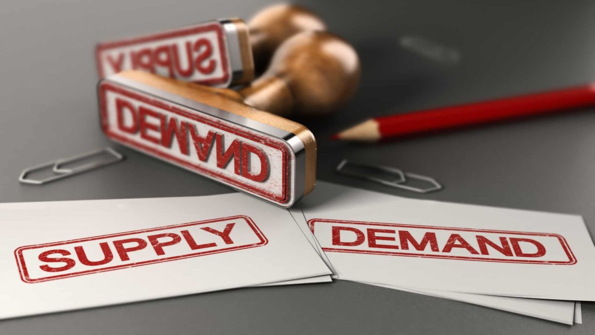 Two stamps with 'supply' and 'demand' written on them