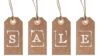 four product tags spelling out the word 'sale'