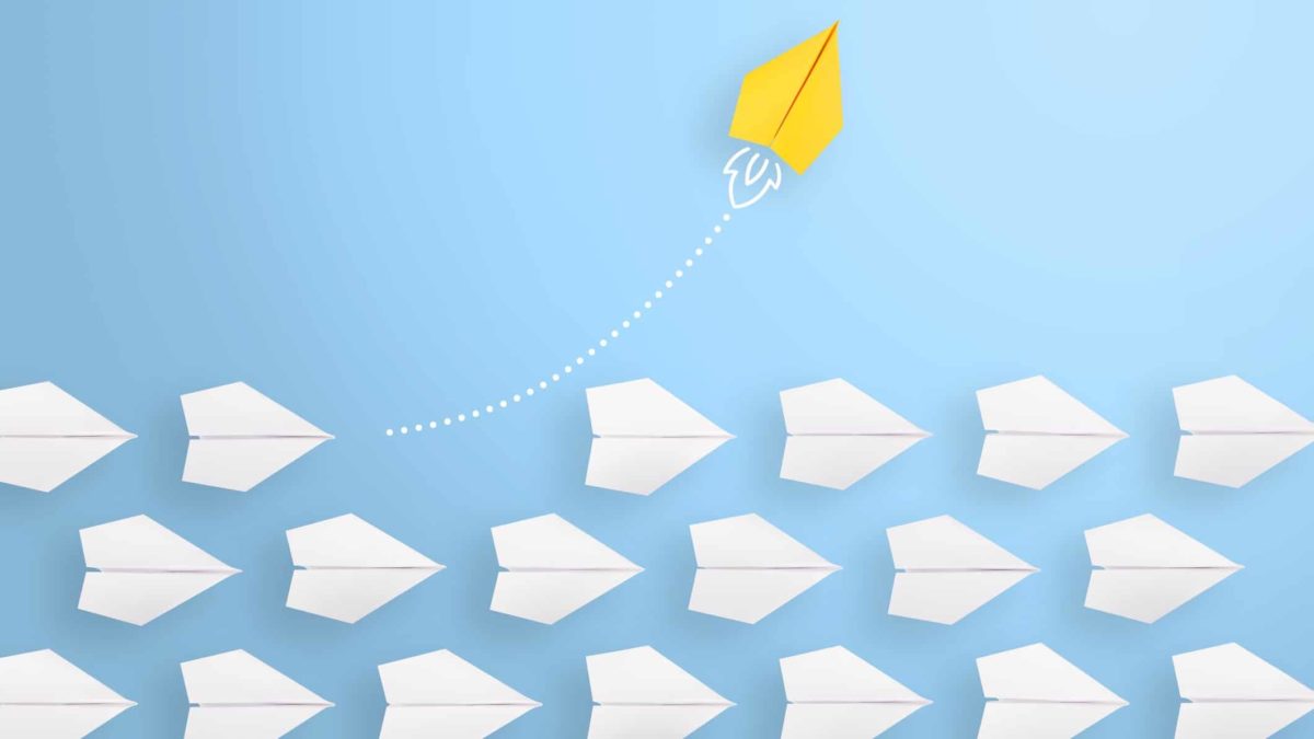 Yellow paper plane flying high above other paper planes representing asx travel shares.