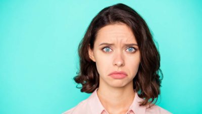 falling asx share price represented by woman making sad face