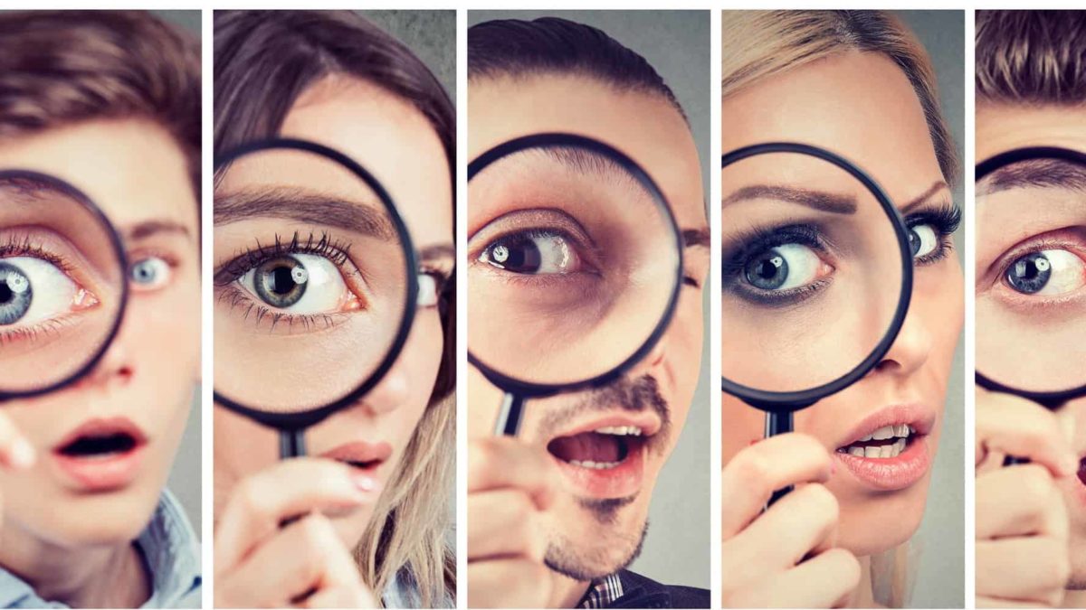 asx share price on watch represented by group of prople all looking through magnifying glasses