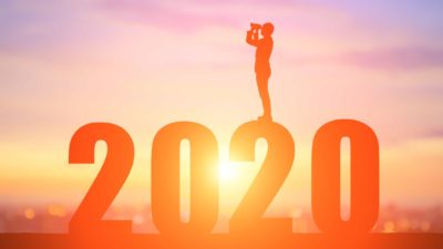asx shares and REITs outlook represented by man standing on giant 2020 looking out with binoculars