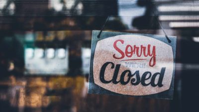 collins foods share price represented by restaurant door with closed sign hanging on it