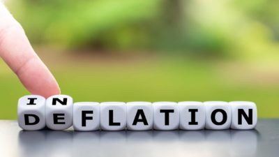 Effect of inflation on asx shares represented by finger pointing to letter blocks spelling the word inflation