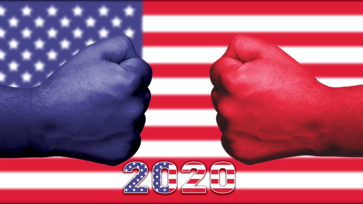 shares to buy in US election represented by blue and red fists coming together against backdrop of US flag