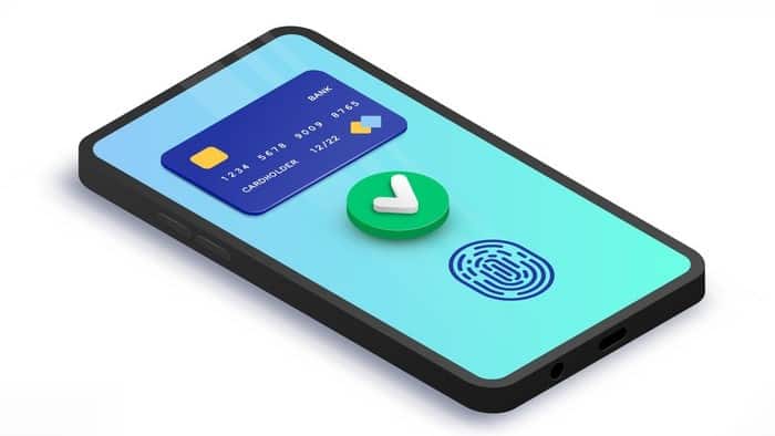 mobile phone displaying visa credit card, tick symbol and thumb print