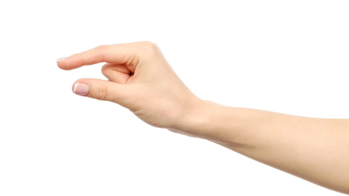 asx share price inching higher represented by hand making gesture of small amount