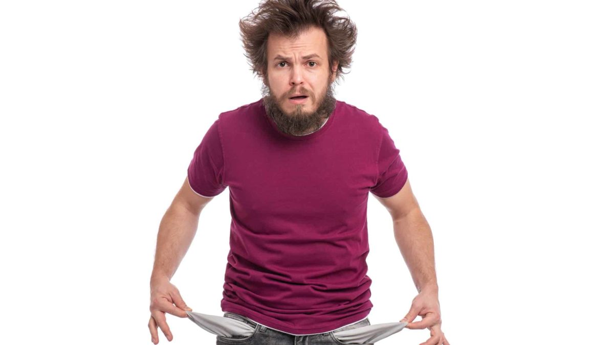 Falling asx share price represented by disgruntled man turning out empty pockets