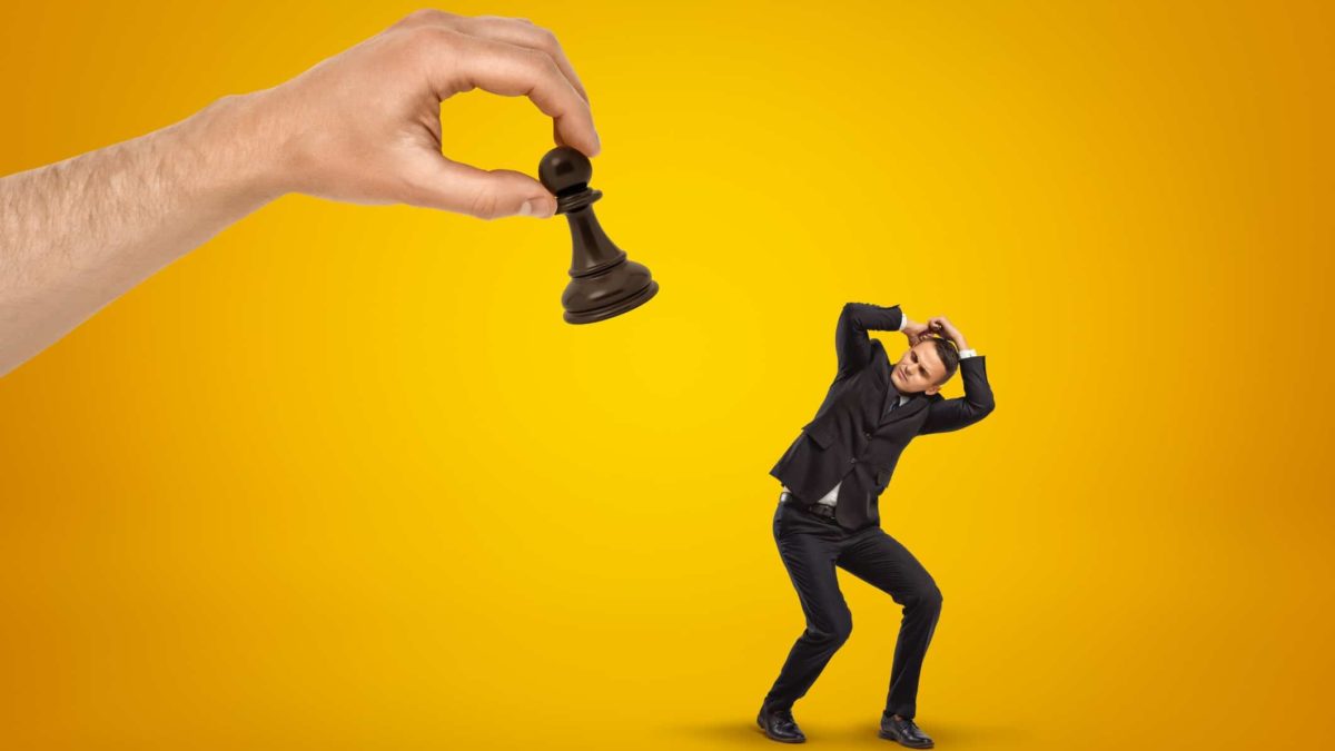 asx 200 rebalance represented by giant hand placing chess piece on top of cowering business man