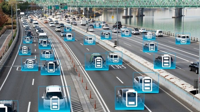 ASX lithium shares upgrade battery shares represented by lots of electric vehicles driving along road